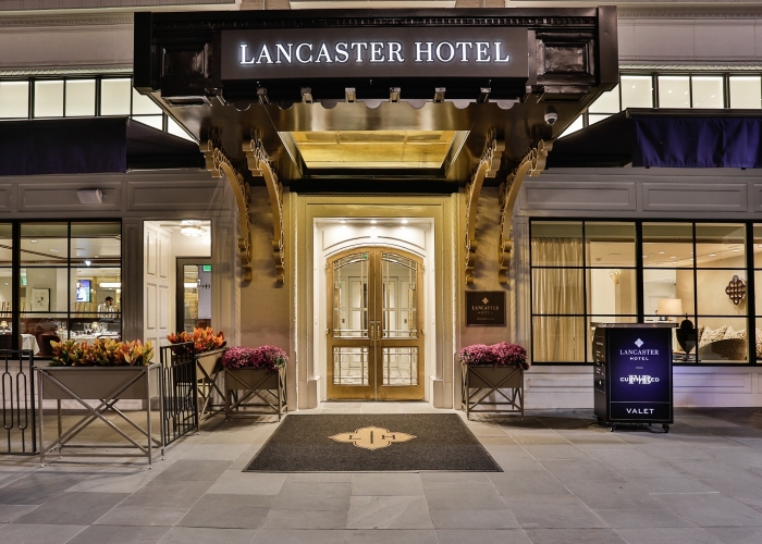 The Lancaster Hotel entrance and marquee in Houston Theater District at night