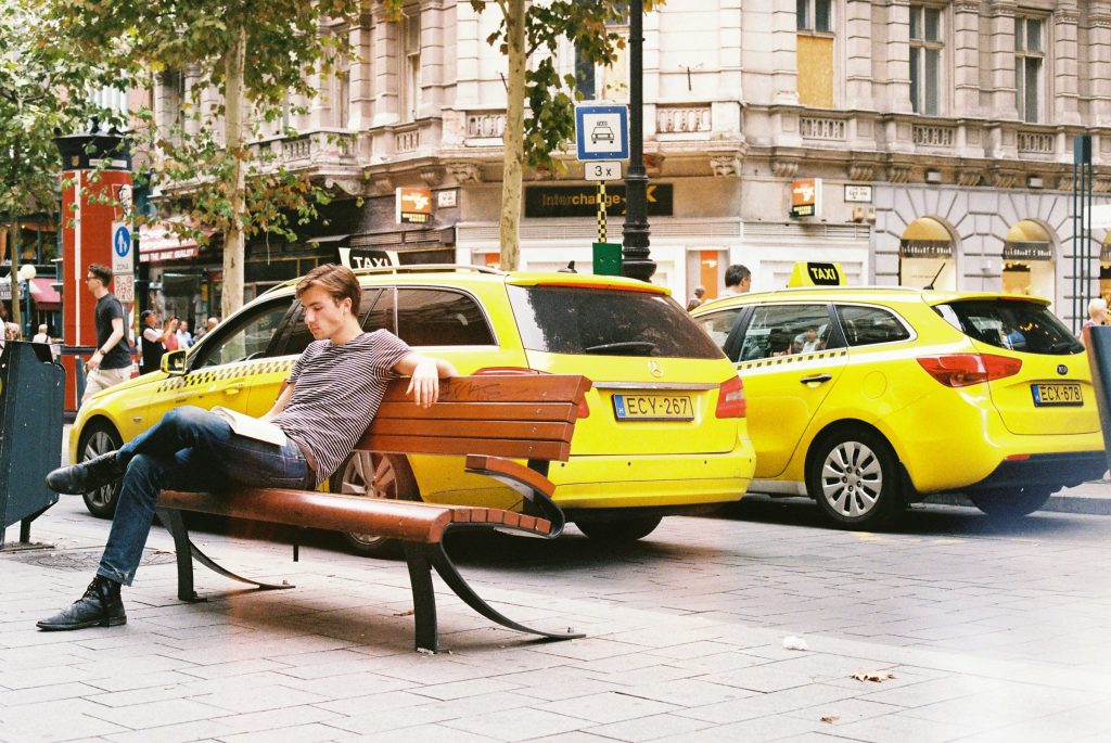 Yellow taxis parked along a city street