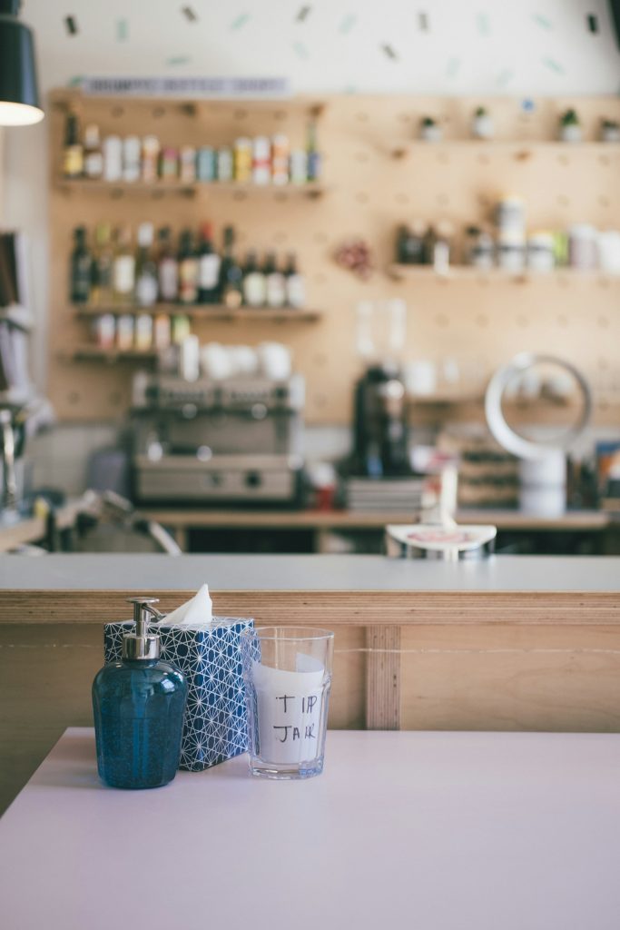 Small tip jar on a café counter