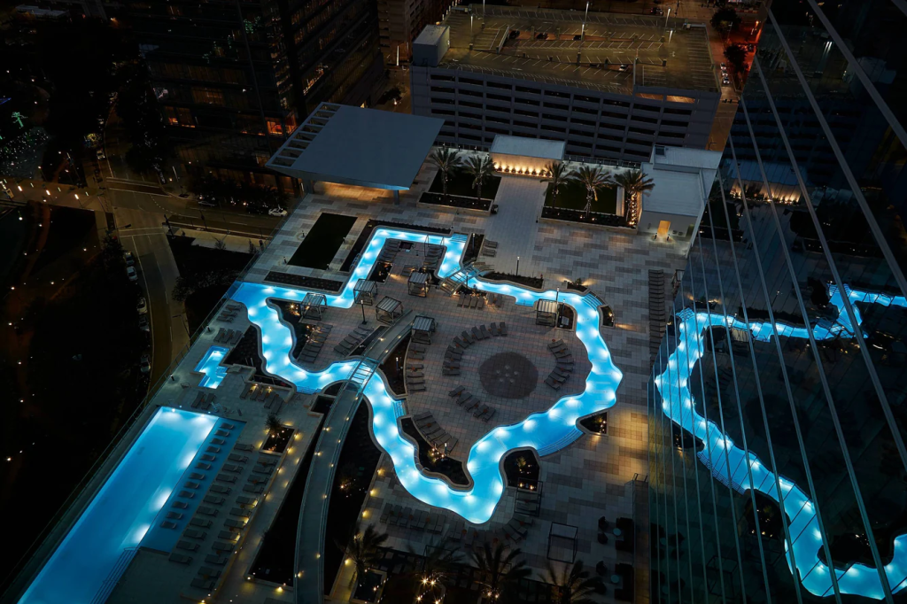 Marriott Marquis Houston rooftop Texas-shaped lazy river at night (Downtown)