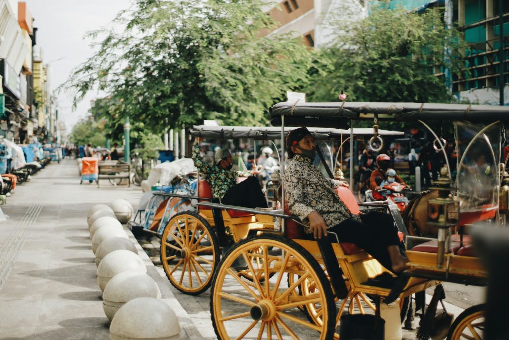 Becak pedicabs on a street in Yogyakarta, Java, Indonesia