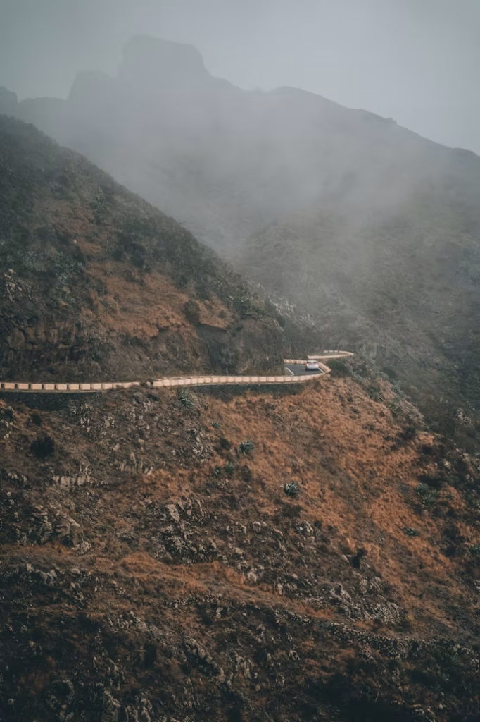 Car driving along winding mountain road in Tenerife