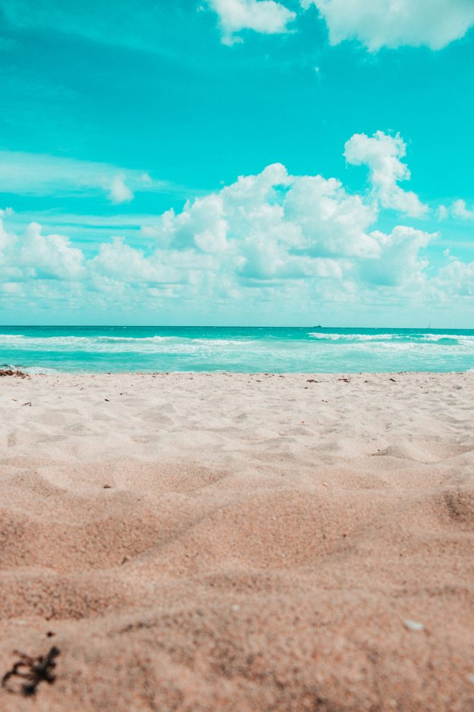 Sunny Miami beach with turquoise ocean and soft sand
